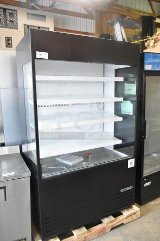 Brand new True TOAM-48GS-HC refrigerated air curtain merchandiser, 48", glass sides, 208-230V, 1 phase, minor scratches.