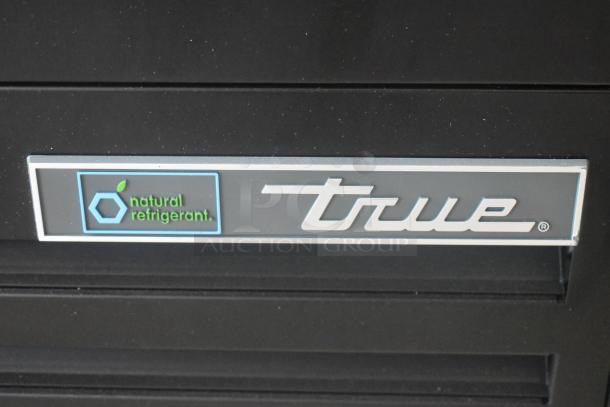 Brand new True TOAM-48GS-HC 48" refrigerated air merchandiser with glass sides. Features "natural refrigerant" label.