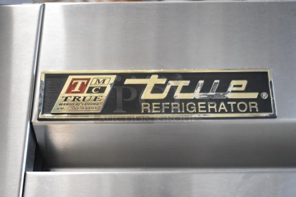 True T-72 stainless steel 3-door commercial cooler, 115V, 1 phase, features True branding and St. Louis manufacturing label.