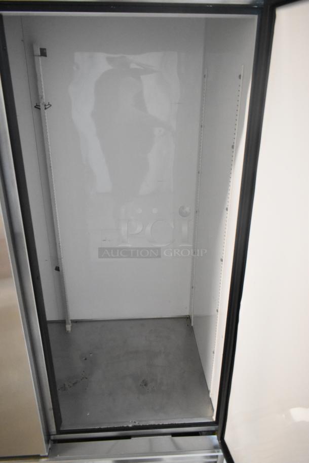 True T-72 Stainless Steel 3-Door Reach In Cooler, commercial grade, 115 volts, 1 phase, interior view shown.
