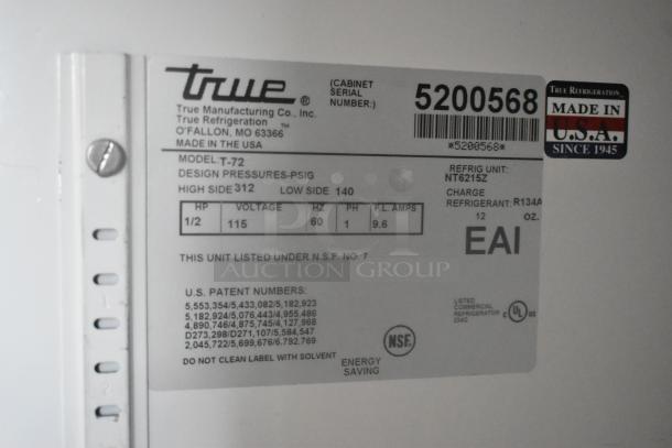 True T-72 stainless steel commercial 3-door reach-in cooler label. Shows model, voltage, and refrigerant details.