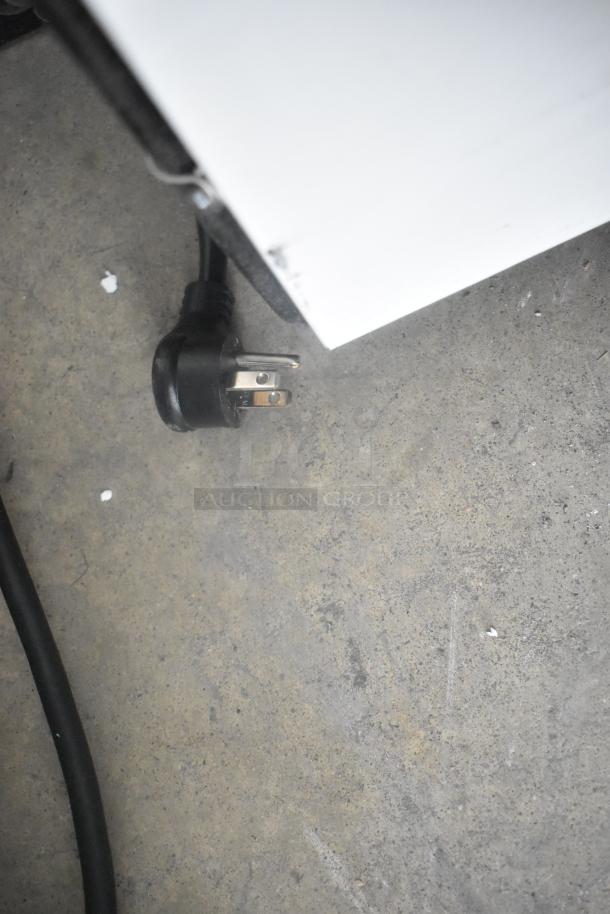 Plug for True T-72 stainless steel commercial 3-door reach-in cooler, 115 volts, 1 phase. Appears in good condition.