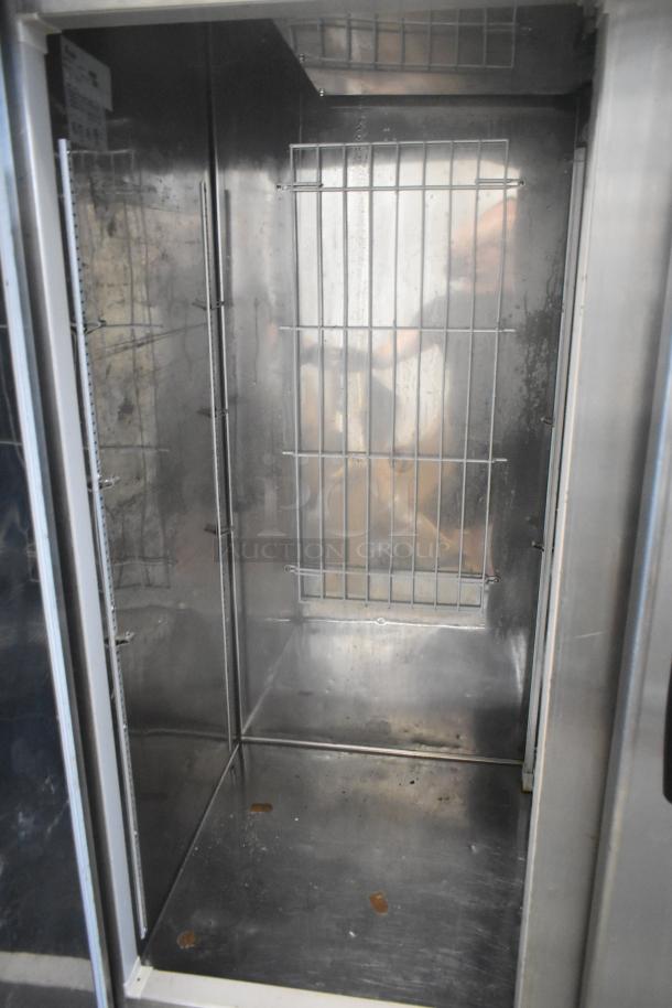 Kool Star KSR49-S stainless steel commercial 2-door reach-in cooler, interior view, on commercial casters, 115 volts, 1 phase.