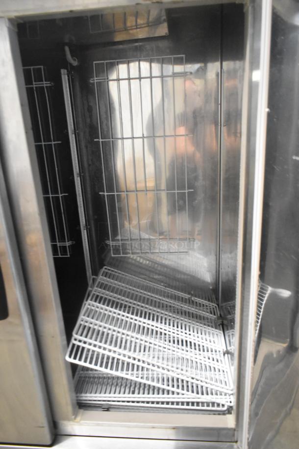 Kool Star KSR49-S stainless steel commercial 2-door cooler interior, shelves visible, on commercial casters, 115 volts, 1 phase.