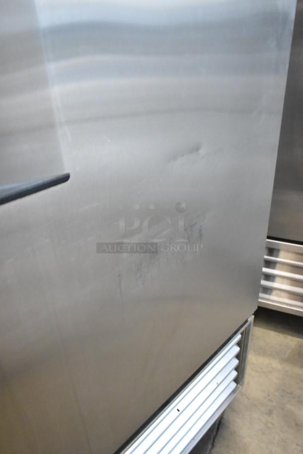 True T-23F stainless steel commercial freezer on casters, 115 volts, 1 phase, showing minor surface marks.