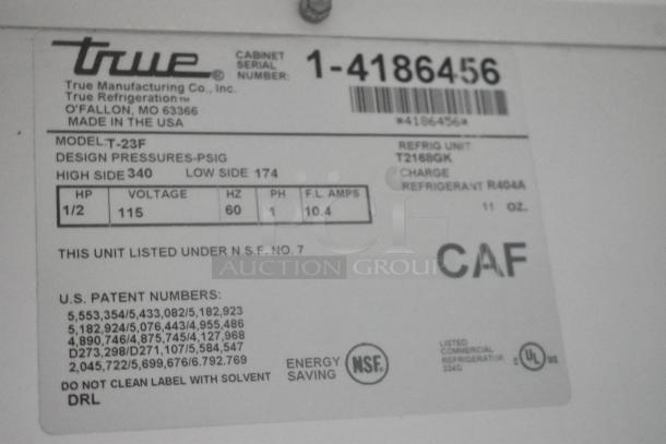 Label from True T-23F Stainless Steel Commercial Freezer showing model details, voltage 115V, 1 phase, NSF listed.
