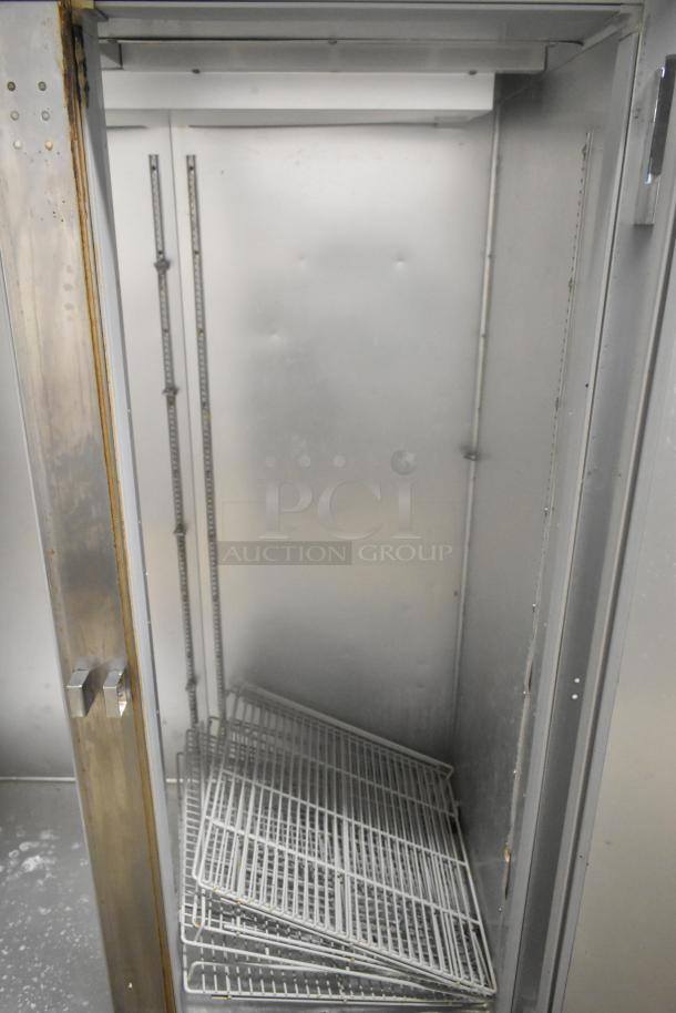 Beverage Air HF2-1S stainless steel commercial 2-door reach-in freezer, shown open with wire shelves, on casters.