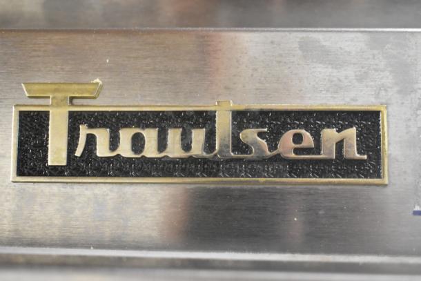 Traulsen logo on stainless steel surface, part of ALT132DUT-HHS commercial freezer.