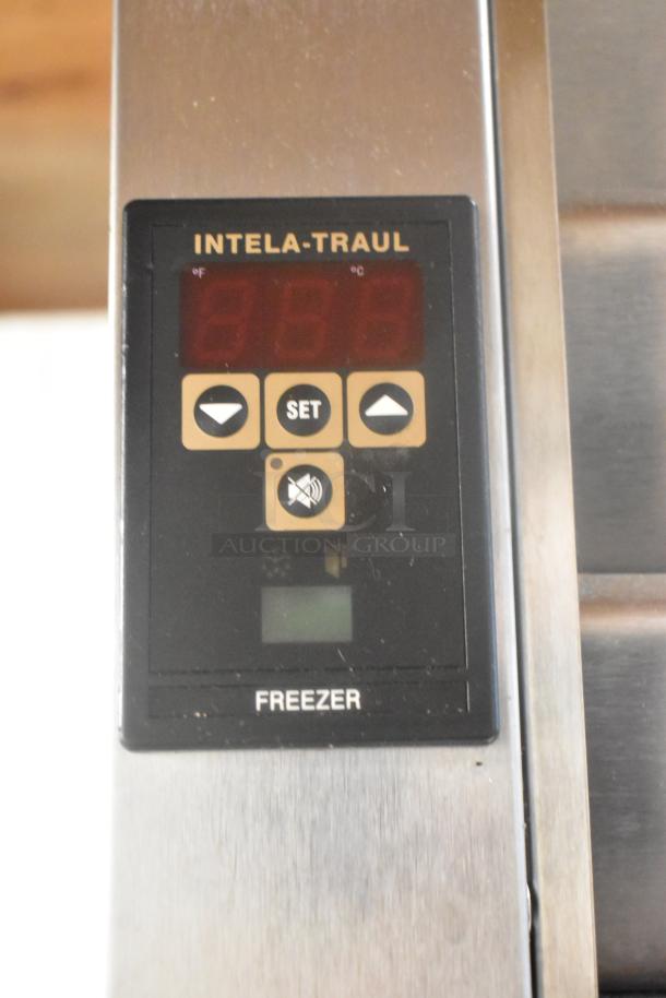 Traulsen ALT132DUT-HHS stainless steel commercial freezer control panel, featuring Intela-Traul display and buttons.