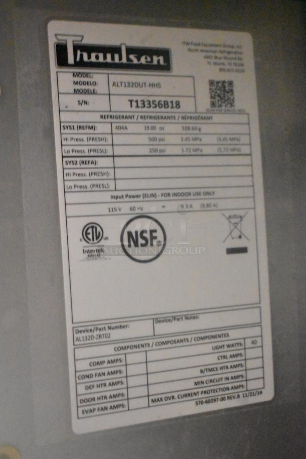 Label on Traulsen ALT132DUT-HHS stainless steel freezer shows model, serial number T13356B18, electrical specs, and safety certifications.