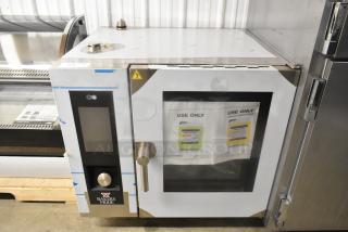 Bakers Pride AEHE061R stainless steel combi convection oven, brand new with minor scratches. 208V, 3 phase, commercial use.