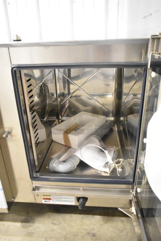 Bakers Pride AEHE061R stainless steel combi convection oven, brand new scratch and dent, 208V, 3 phase, interior view.