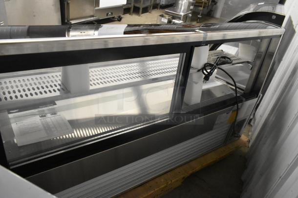 BRAND NEW Vollrath RDE8160 60" refrigerated display, curved glass, countertop model, 120V, slight dents visible, includes manual.