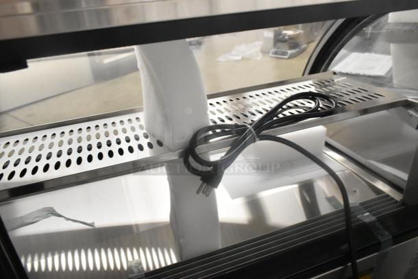BRAND NEW Vollrath RDE8160 60" curved glass refrigerated display cabinet. Features scratch and dent condition, 120V, 1 phase, includes power cord.