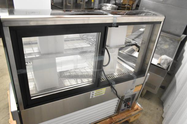 Brand new Vollrath HDE8136 36" curved glass heated display cabinet, 120V, 1 phase, with visible control panel and wiring.
