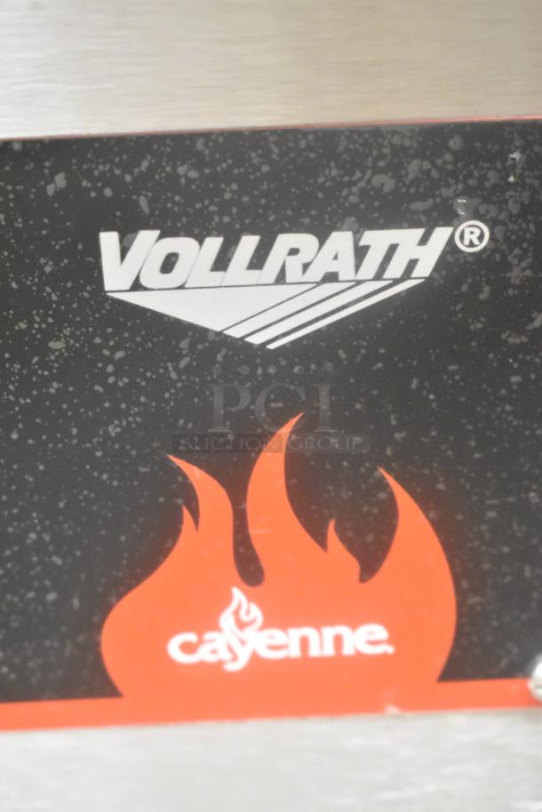 Vollrath Cayenne FTG-9048 stainless steel commercial griddle, 112,000 BTU, natural gas, flat top, logo visible.