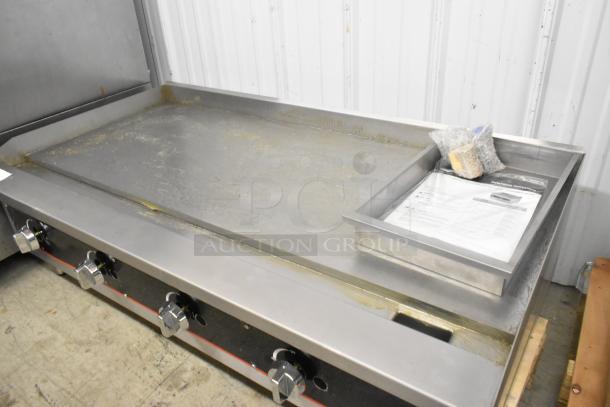 Vollrath Cayenne FTG-9048 Stainless Steel Gas Griddle, 112,000 BTU, commercial use, good condition, visible instructions and accessories.
