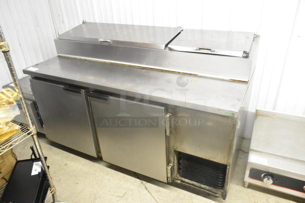Beverage Air DP67 stainless steel commercial pizza prep table on casters, 115V, 1 phase, good condition.