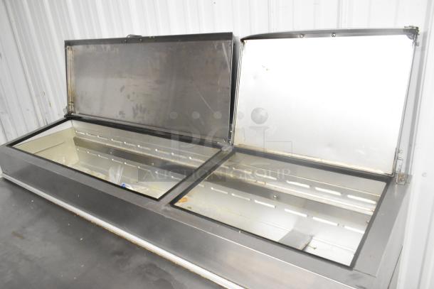 Beverage Air DP67 stainless steel commercial pizza prep table, dual compartment, on casters, 115V, good condition.