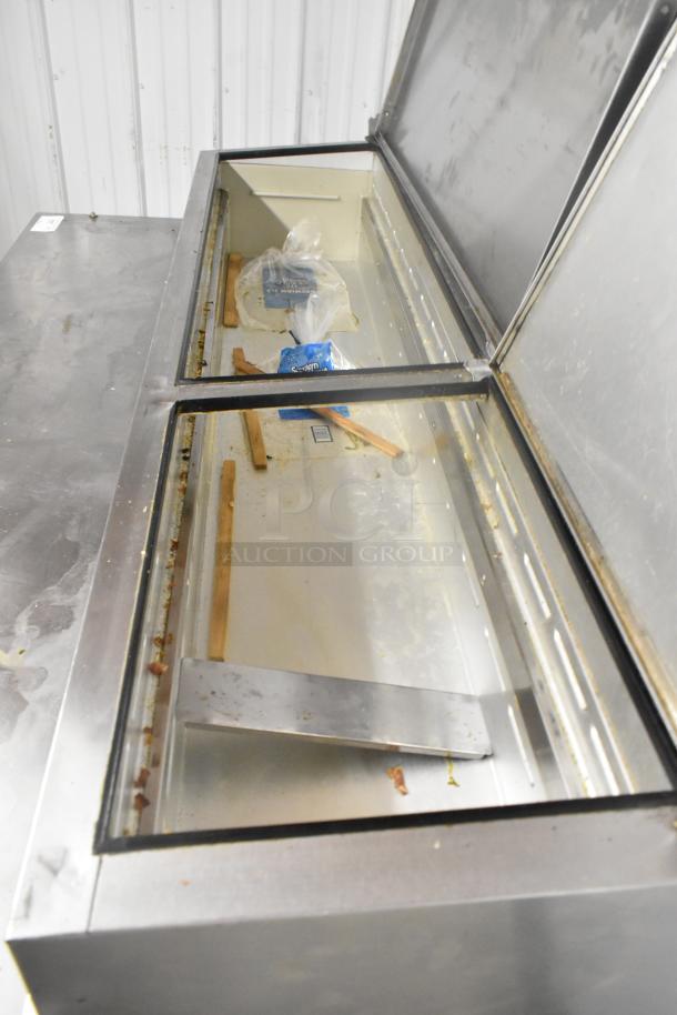 Beverage Air DP67 stainless steel pizza prep table on casters, used condition, 115 volts, 1 phase, interior view of prep area.