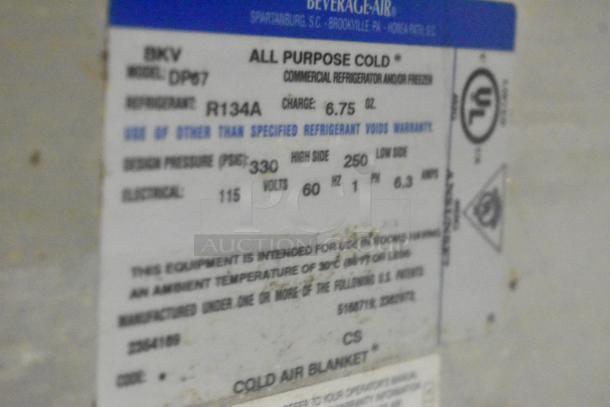Beverage Air DP67 pizza prep table label, indicating model, refrigerant type R134A, voltage 115, UL certification.