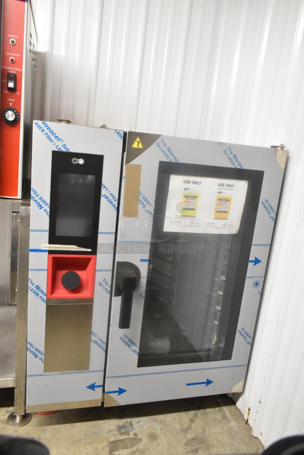 Brand new scratch and dent Blodgett AETG101R stainless steel commercial combi convection oven. Touchscreen display visible.
