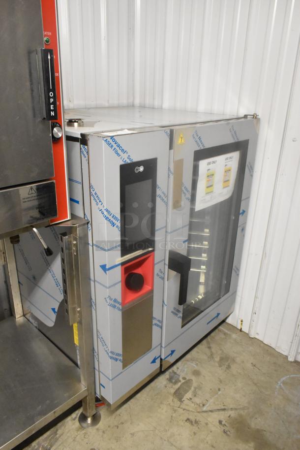Brand new Blodgett AETG101R stainless steel commercial combi convection oven; scratch and dent condition.