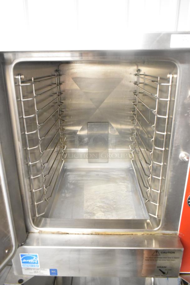Vulcan VPX5 stainless steel steam cabinet with interior racks, Energy Star label, 208V, 3 phase, on equipment stand.