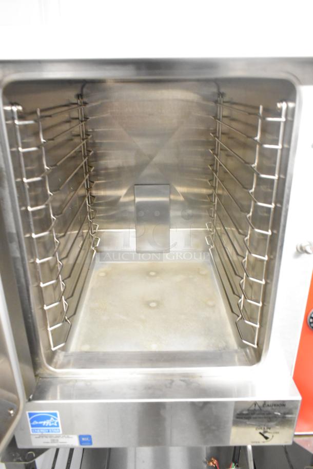 Vulcan VPX5 stainless steel steam cabinet, single deck, electric, 208V, 3 phase, on equipment stand, interior view.
