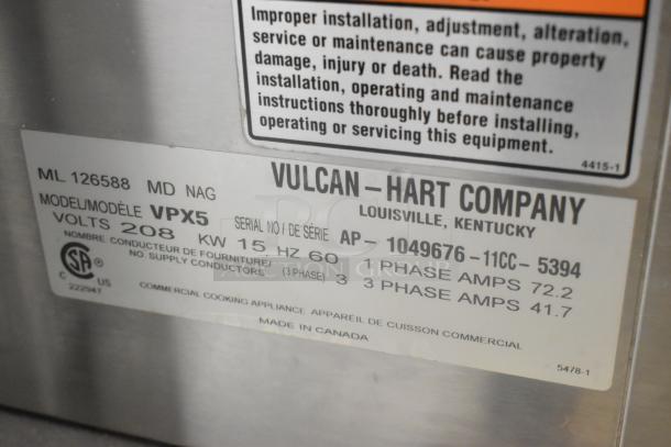 Vulcan VPX5 steam cabinet data plate, shows model, voltage (208V, 3 phase), and serial number. Stainless steel design for commercial use.