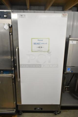 Arctic Air F22CWF3 Single Door Freezer on commercial casters. Model F22CWF3, 115V, 1 Phase. "Do Not Unplug" sign on door.