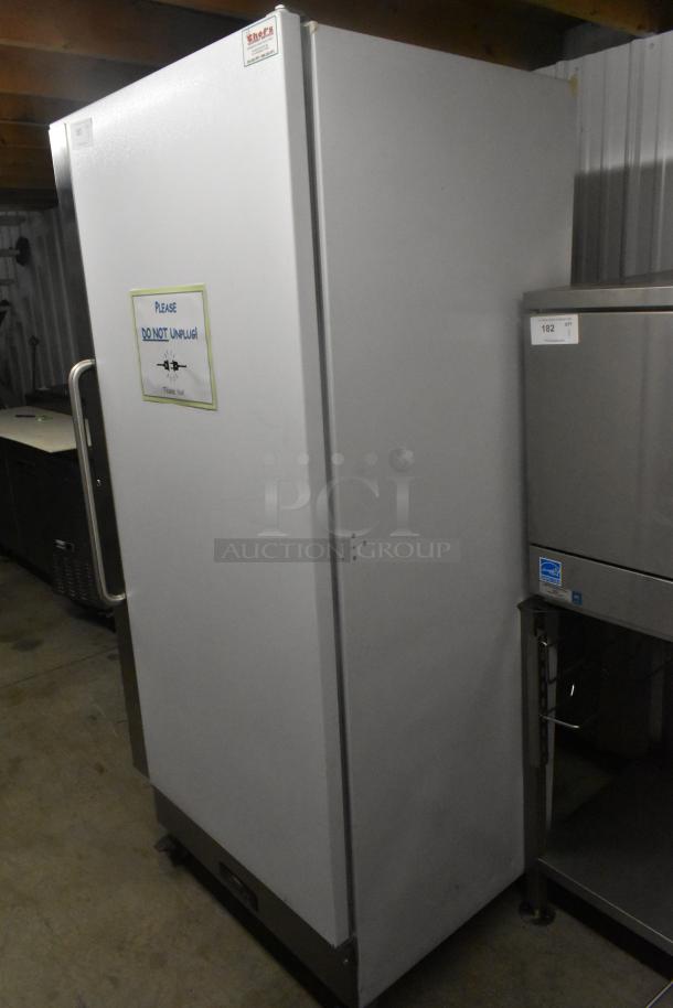 Arctic Air F22CWF3 single door reach-in freezer on commercial casters, 115 volts, 1 phase, with "Do Not Unplug" sign.
