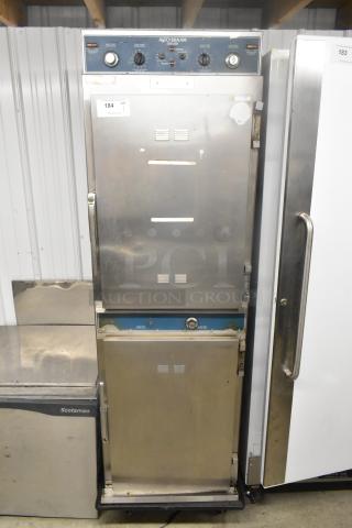 Alto Shaam 1000-TH-I stainless steel commercial Cook N Hold oven with control knobs, on casters, in used condition.