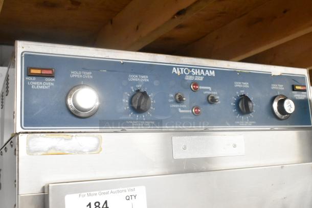 Alto Shaam 1000-TH-I stainless steel commercial Cook N Hold oven, 208-240 volts, on casters. Control panel displays various dials and switches. Features "Halo Heat" technology.