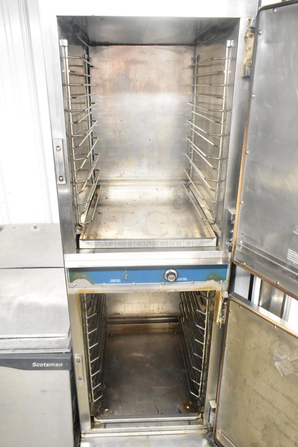 Alto Shaam 1000-TH-I stainless steel commercial Cook N Hold oven, showing interior, on casters. 208-240 volts. Good condition.