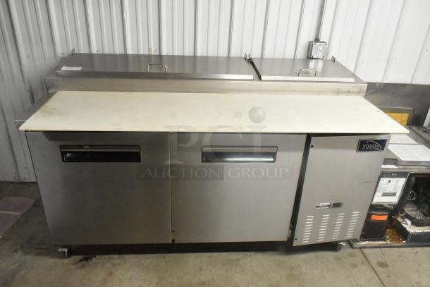 Yukon YPP71 stainless steel commercial pizza prep table with cutting board, two compartments, on casters. 115 volts, 1 phase.