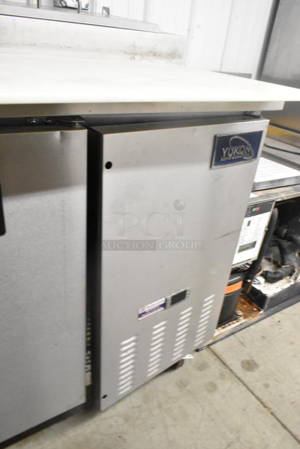 Yukon YPP71 stainless steel commercial pizza prep table with casters, 115 volts, 1 phase, visible brand label.