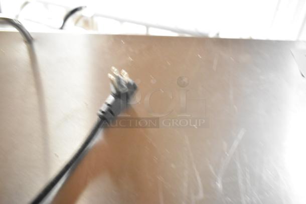 Yukon YPP71 stainless steel commercial pizza prep table with power cord, on commercial casters, 115 volts, 1 phase.