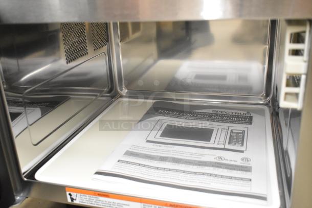 Winco EMW-1000ST stainless steel commercial microwave, 120V, 1 phase, interior view with user manual, excellent condition.