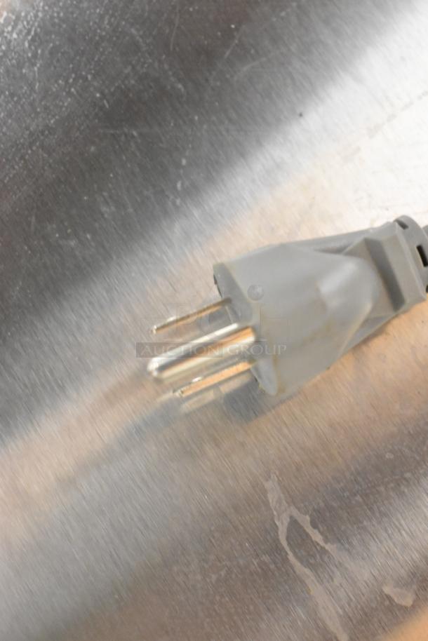 Winco EMW-1000ST microwave oven plug on stainless steel surface, 120V, 1 phase.