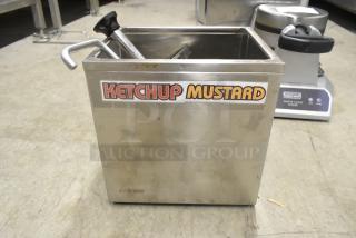 Winco PKTS-2D stainless steel condiment rail with a pump, labeled for ketchup and mustard, shows minor wear.