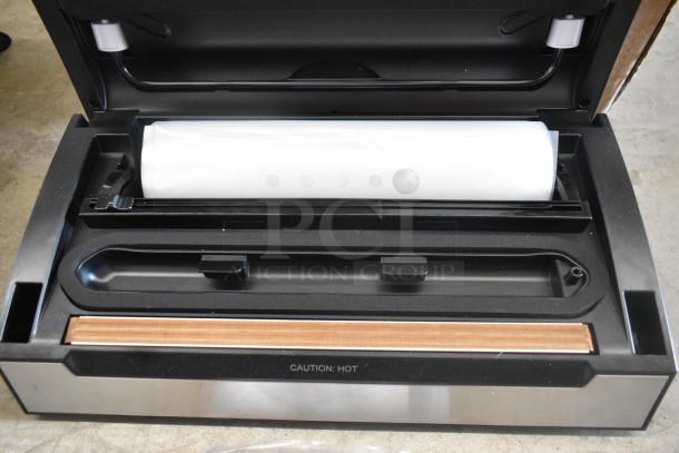 BRAND NEW VacPak-It 186VSM12PRO external vacuum sealer, 12" seal bar, cutter, roll holder, 120V, 1 phase, with minor scratches.