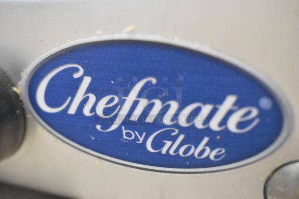 Globe Chefmate stainless steel commercial meat slicer, brand new with minor scratches. Features blade sharpener, 115V, 1 phase, Chefmate by Globe label.