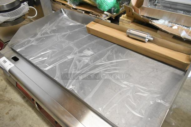 Brand new Avantco 177EG30N stainless steel electric flat top griddle, scratch and dent condition, 208/240V, 1 phase.