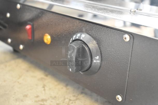 Close-up of the Avantco 177HDC26 heated display case showing the control panel with an adjustable temperature knob.