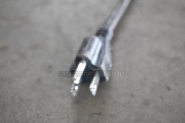 Blurry image of a power plug end, likely for a Narvon NSSM3 commercial slushie machine.
