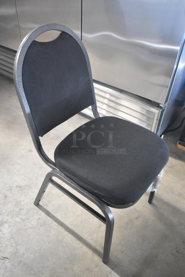 Black metal stackable banquet chair, new, slight scuffs, cushioned seat, arched back, durable frame, ideal for events.