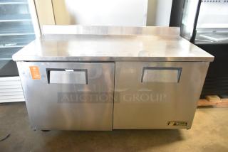 True TWT-60F stainless steel commercial work top freezer, 2 doors, on casters, 115 volts, 1 phase, excellent condition.