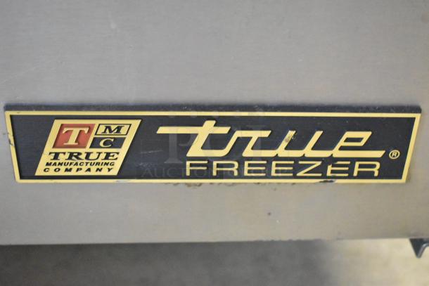 True TWT-60F stainless steel 2-door work top freezer, commercial casters, 115V, 1 phase. True logo visible.