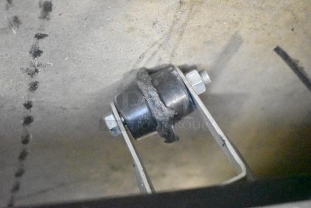 Close-up view of hardware component from a True TWT-60F freezer, showing condition and connection detail.